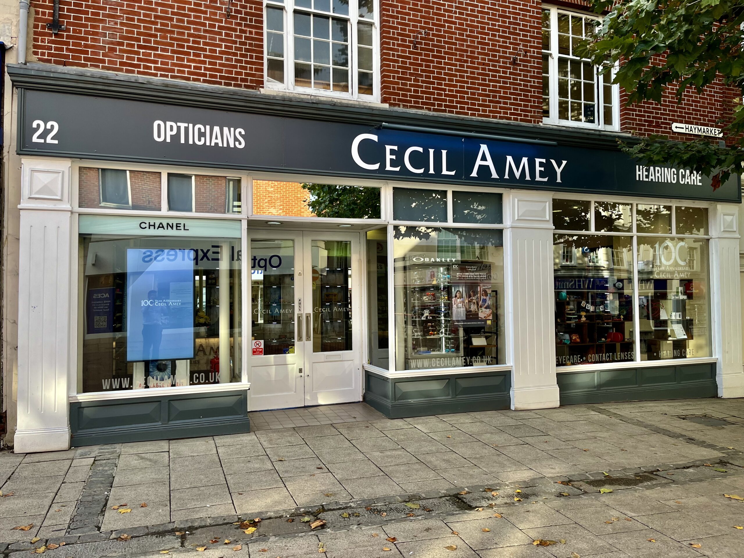 Cecil Amey Opticians, navy fascia and cream serif wordmark, 22a Haymarket, Norwich